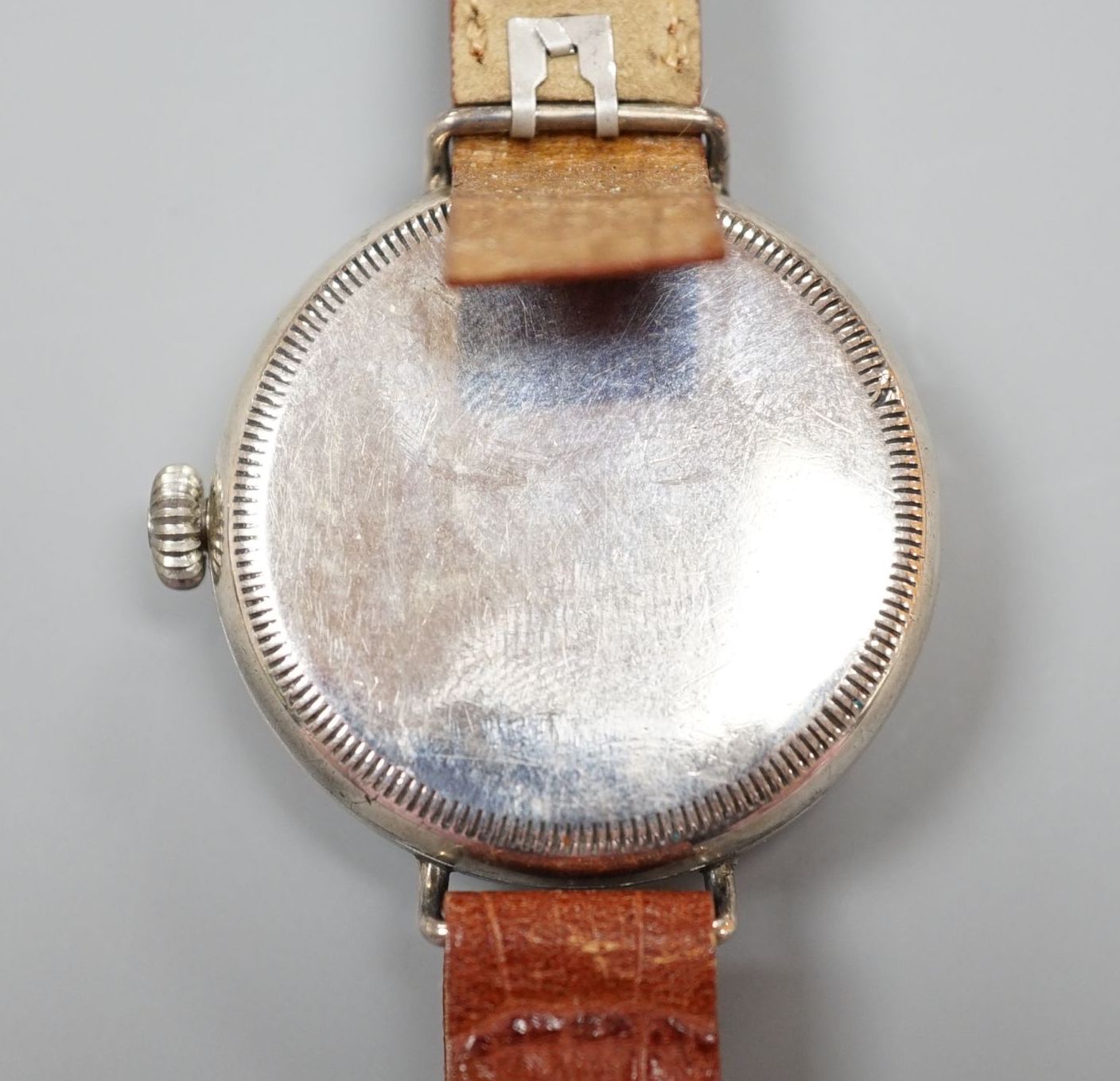A gentleman's 1920's silver J.W. Benson manual wind wrist watch, with Cyma movement and white Arabi dial with subsidiary seconds, case diameter 36mm, on later strap.